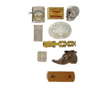 A CAST ALLOY HUMAN SKULL VESTA CASE, TWO OTHERS, A VICTORIAN GILT BRASS SOVEREIGN BALANCE, A VICTORIAN SILVER PLATED OVAL SNU