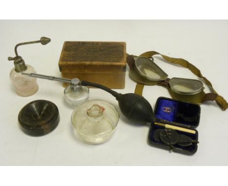 A PAIR OF VINTAGE ALUMINIUM AND FABRIC FLYING GOGGLES, A GLASS SCENT BOTTLE WITH ATOMISER ATTACHMENT, SEVERAL SURGICAL INSTRU