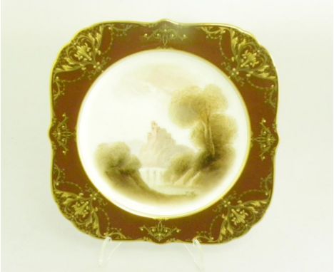 A ROYAL WORCESTER SHAPED SQUARE DESSERT PLATE, PAINTED BY RUSHTON, SIGNED WITH A CASTLE IN A RIVER LANDSCAPE RESERVED ON A RI
