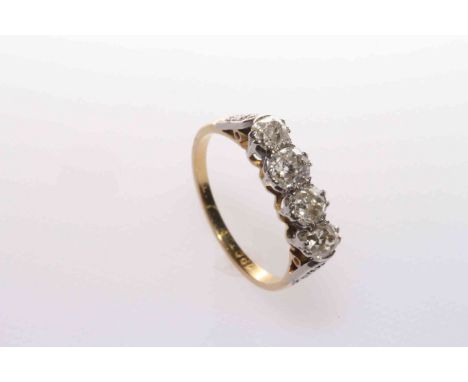 18 carat gold and four-stone diamond ring, size M