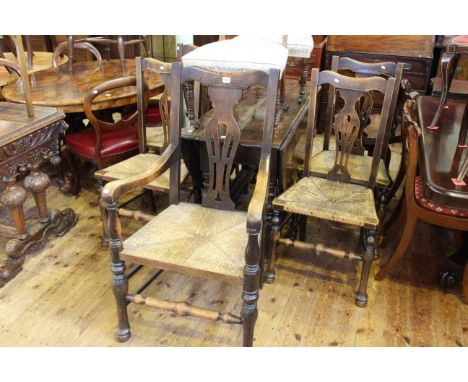 Oak gate leg dining table and five rush seated dining chairs