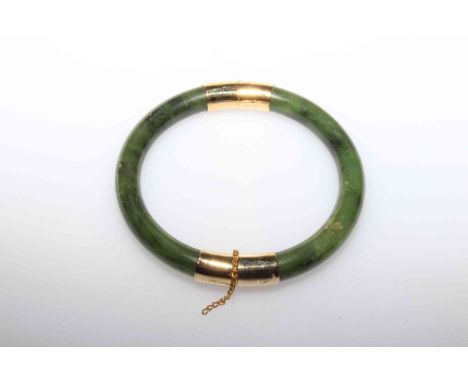 Nephrite jade green bangle with yellow metal mounts