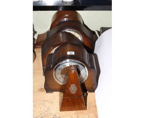 Four oak and walnut mantel clocks and metronome