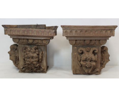 Pair of antique carved wood block capitals, each with two satyr mask heads, foliate egg and dart and tongue moulding, probabl