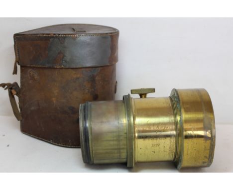 Victorian brass portrait camera lens by Andrew Ross of London, no. 2924, 4½" diam., contained in leather case. Condition repo