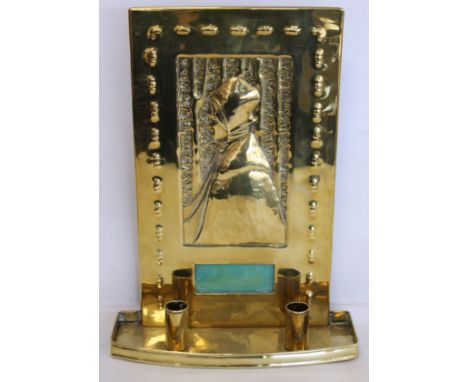 Arts & Crafts brass double wall sconce of rectangular form in the manner of Glasgow School of Art, with repousse panel of a g