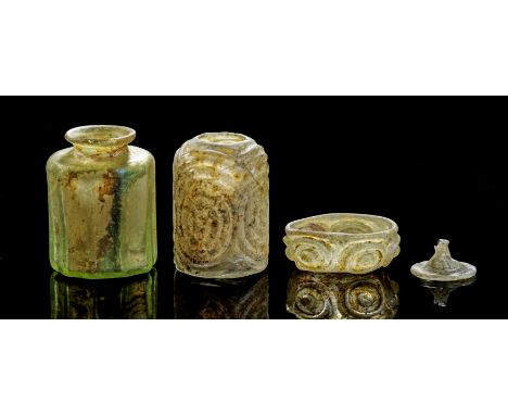 Sammlung islamischer Gläser. ca. 9. - 12. Jh. Aus farblosem und grünlichem Glas. a) H 6cm. Zylindrische, facettierte Flasche 