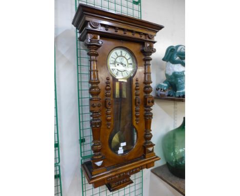 A 19th Century walnut Vienna double weight wall clock 