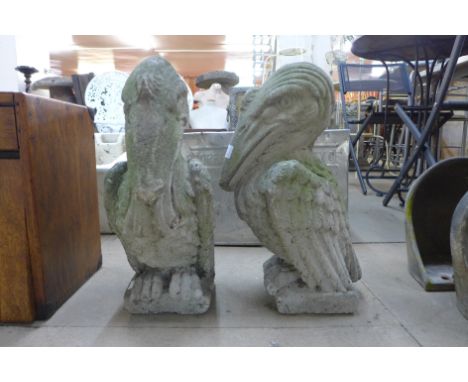 A pair of mythical concrete garden figures 