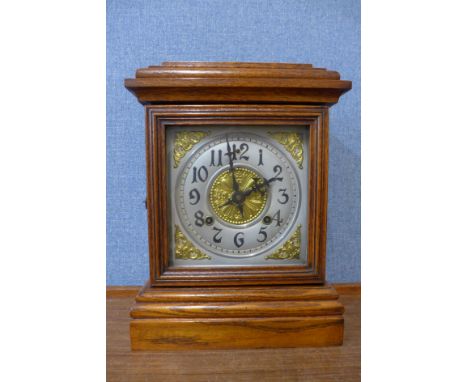 A late 19th Century American Ansonia Clock Co. oak shelf clock 