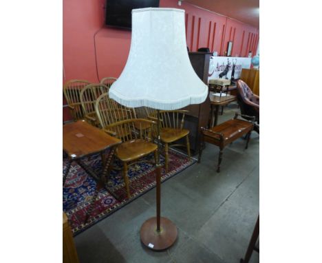 A teak standard lamp 