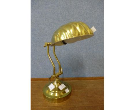 A brass desk lamp 