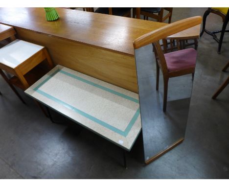 A teak framed mirror and a Formica coffee table 