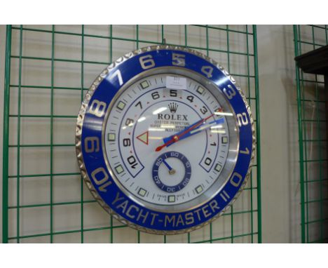 A Rolex style dealer's wall clock 