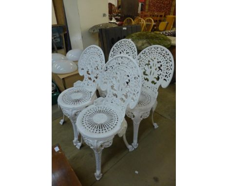 A set of four painted cast alloy garden chairs 