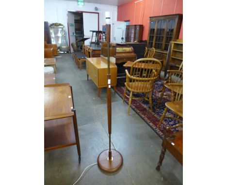 A teak standard lamp 
