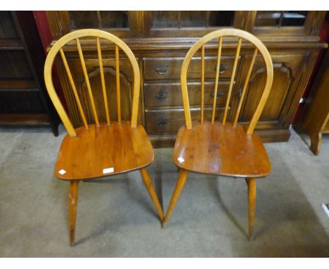 A pair of Ercol Blonde elm and beech Windsor chairs 