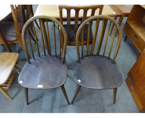 A pair of Ercol Golden Dawn elm and beech Windsor chairs 