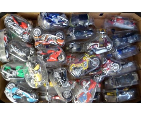 Maisto Model Motorbikes, 75+ 1:18 scale Maisto model motorbikes in original plastic packaging together with black plastic nam