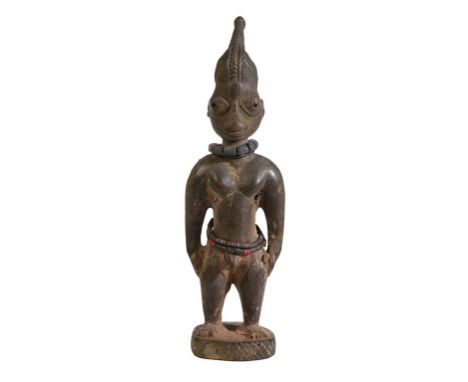 YORUBA WOODEN IBEJI pierced coiffe, very worn and used fine patina, 19th century, 26cm high Provenance: From the Collection o