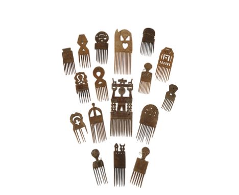 COLLECTION OF WOODEN TRIBAL COMBS a broken but good Ashanti comb with a figure standing on top and others, the largest 33cm