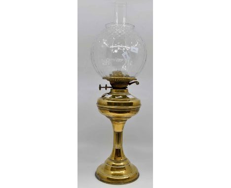 A 19th Century brass oil lamp with glass shade and funnel, miners lamp, plus a pair of 19th Century brass candlesticks (4)