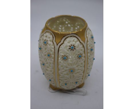  A Royal Worcester baluster reticulated small vase, panels decorated with turquoise flowers within panels lined with gilt, on