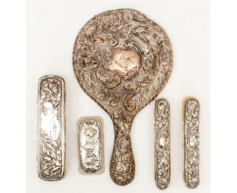 An Edwardian Art Nouveau dressing table brush set comprising: three brushes, powder box and associated mirror (5)&nbsp;