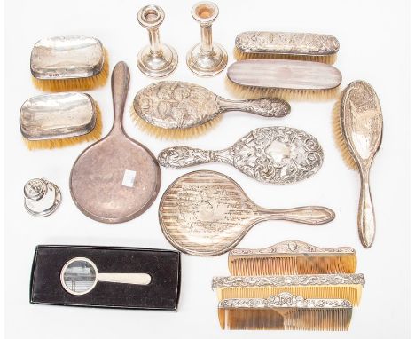 A collection of Edwardian and later sterling silver dressing table items, including brushes, mirrors, inkwell, a pair of cand