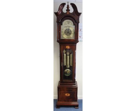 A Howard Miller mahogany musical longcase clock, circa 1990, the hood with a bevelled glazed door, enclosing pierced dial wit