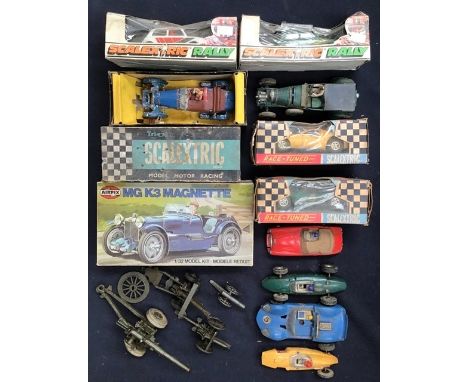 A collection of vintage Scalextric cars, boxed and unboxed, along with Airfix and a steam engine