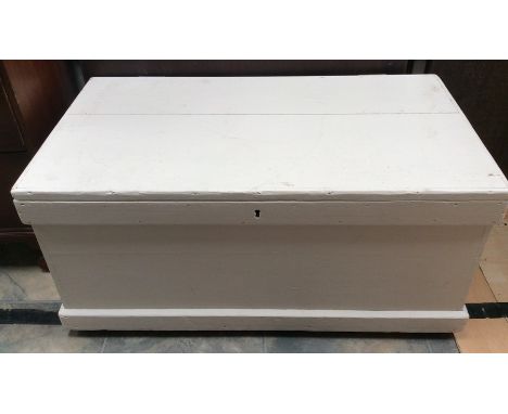 A late 19th Century white painted travelling trunk, carrying handles to sides, 47cm high, 98cm wide, 53cm deep