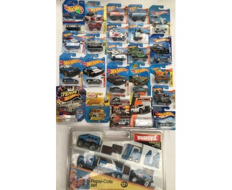 Hot Wheels carded vehicles including Hot Trucks Land Rovers, Fisher Price Gold edition Thomas the Tank Engine, and 1985 Buddy