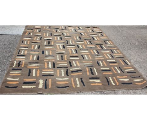 A 1960's design carpet, abstract decoration on a chocolate brown ground, 366cm x 300cm