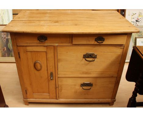 A French Art Nouveau period side cabinet, having a bow fronted top, comprising two drawers over a single cupboard door to lef