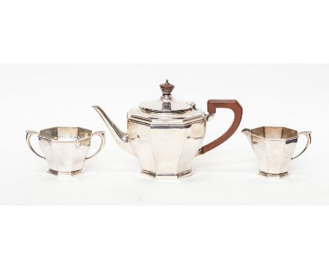 An Art Deco plain octagonal silver three-piece tea set, comprising teapot, milk jug and sugar bowl, by William Neale, Birming