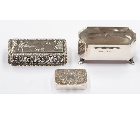 A collection of three various silver boxes to include: George V rectangular box, the cover chased with Gentleman shooting duc