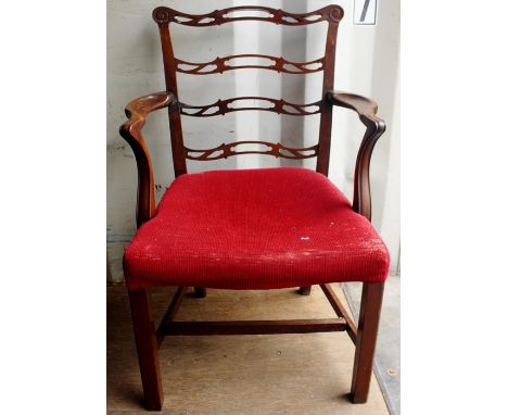 A George III style mahogany open armchair, of ladder-back form, in the manner of Thomas Chippendale, with red fabric overstuf