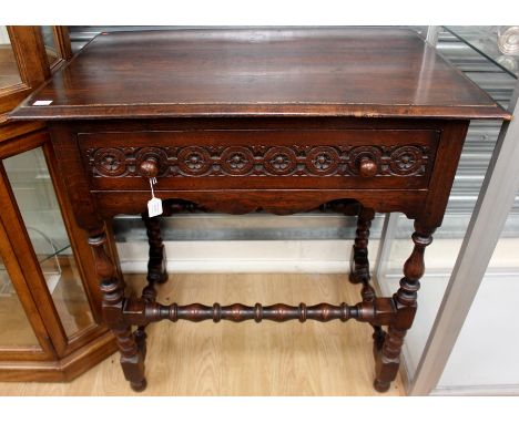 A Jacobean style joined oak side table, made in the traditional manner, fitted with a single drawer, with rosette carving, ra