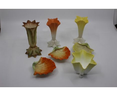 &nbsp;A group of Royal Worcester including: three shell shaped salts, green mark no: G172; a pair of matched leaf shaped posy