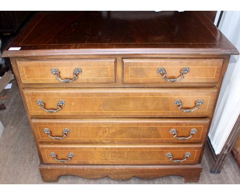A Georgian style mahogany chest of drawers, having two short over three long graduated drawers, bracket feet, 71cm high, 79cm