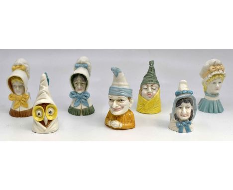 A collection of seven Royal Worcester candle snuffers, including Young Girl, Mob Cap, Mrs Caudle, Mr Caudle, Owl, Punch and O
