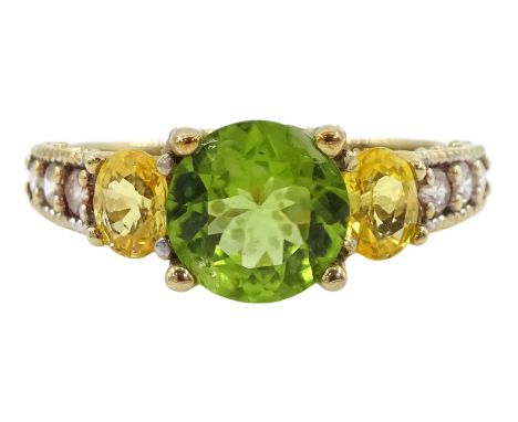 9ct gold peridot and yellow sapphire ring, with white topaz set shoulders, hallmarkedCondition Report:Approx 3.7gm, size R, g