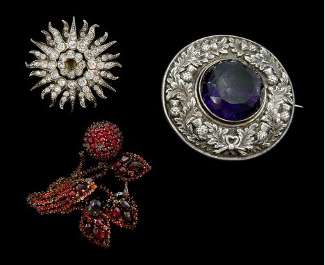 Scottish silver amethyst brooch, garnet spray brooch and a silver paste set star broochCondition Report:Amethyst brooch D5cm,
