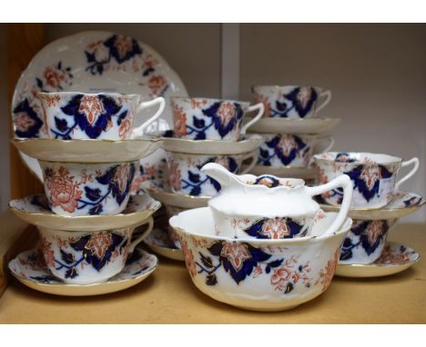 Ceramics - an Edwardian tea set, floral design on white ground, comprising cups, saucers, side plates, slop bowl, bread and b