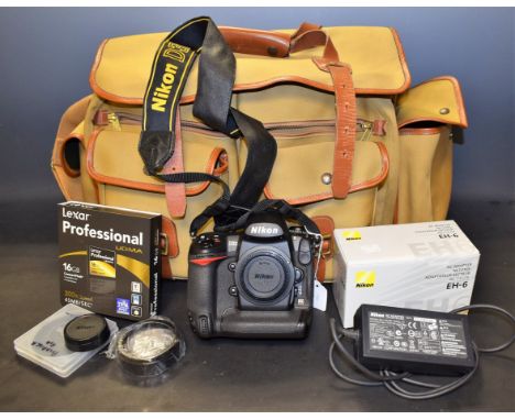 Photography - A Nikon D3X DSLR camera, 2 x 64gb memory cards, D3X strap, manual, software, etc., boxed; A Nikon MH-22 quick c