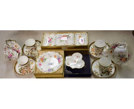 A set of four Royal Worcester coffee cups and saucers; a Royal Crown Derby Posie pattern tea cup and saucer; another; Posie p