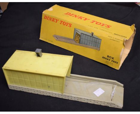 Dinky Toys - 502 Garage, French Issue, yellow plastic garage, grey up and over door with three porthole windows, light grey t