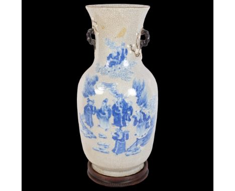 A large Chinese crackle glaze baluster vase, blue and white figural decoration and blossom handles, with back stamp, on turne