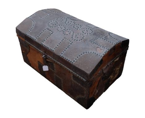 A Vintage wooden and studded leather domed trunk, label to the inside reads Francis Thomas Sadler, Newcastle, 61cm x 35cm x 3
